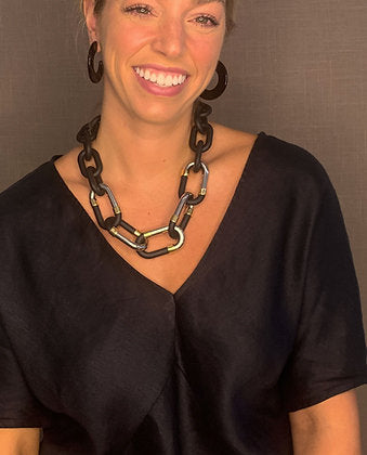 model wearing resin earrings in black