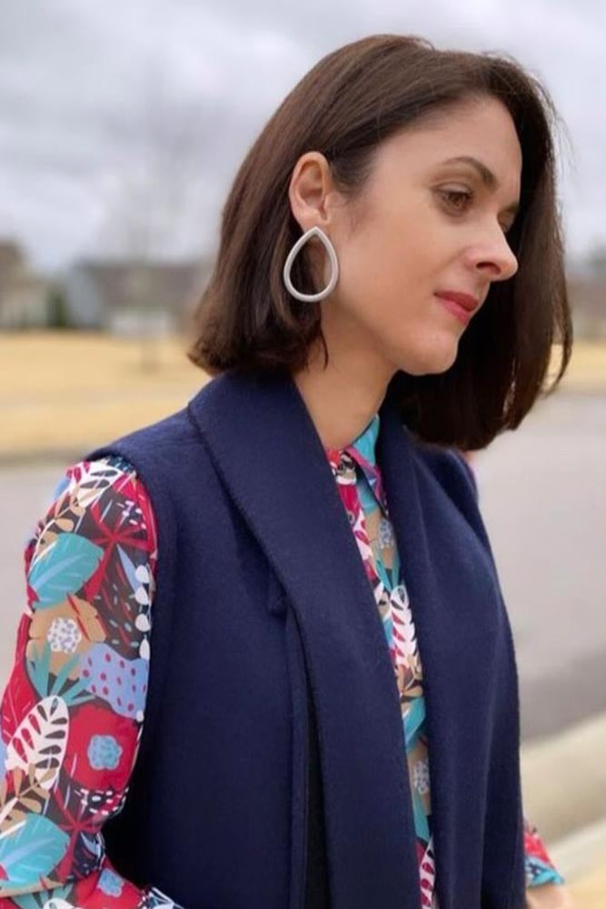 Model wearing resin earrings in matte silver