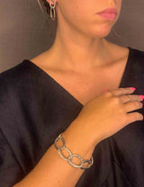 model wearing organic-shaped silver bracelet