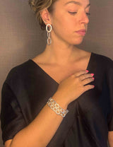 model wearing organic-shaped silver bracelet