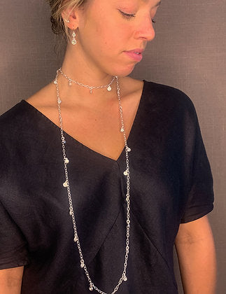 model wearing organic-shaped silver earrings