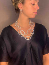 model wearing organic-shaped silver necklace