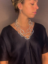 model wearing organic-shaped silver necklace