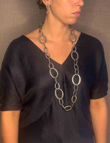 model wearing organic-shaped silver necklace