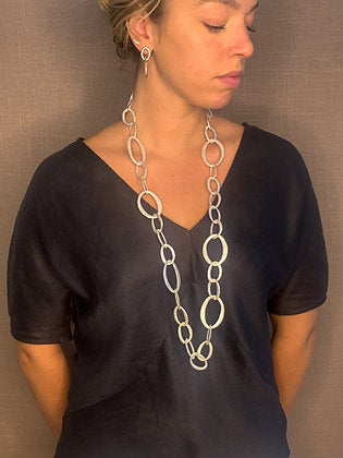 model wearing organic-shaped silver necklace