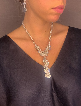 model wearing organic-shaped silver necklace