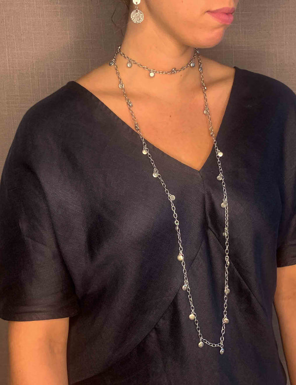 model wearing organic-shaped silver necklace