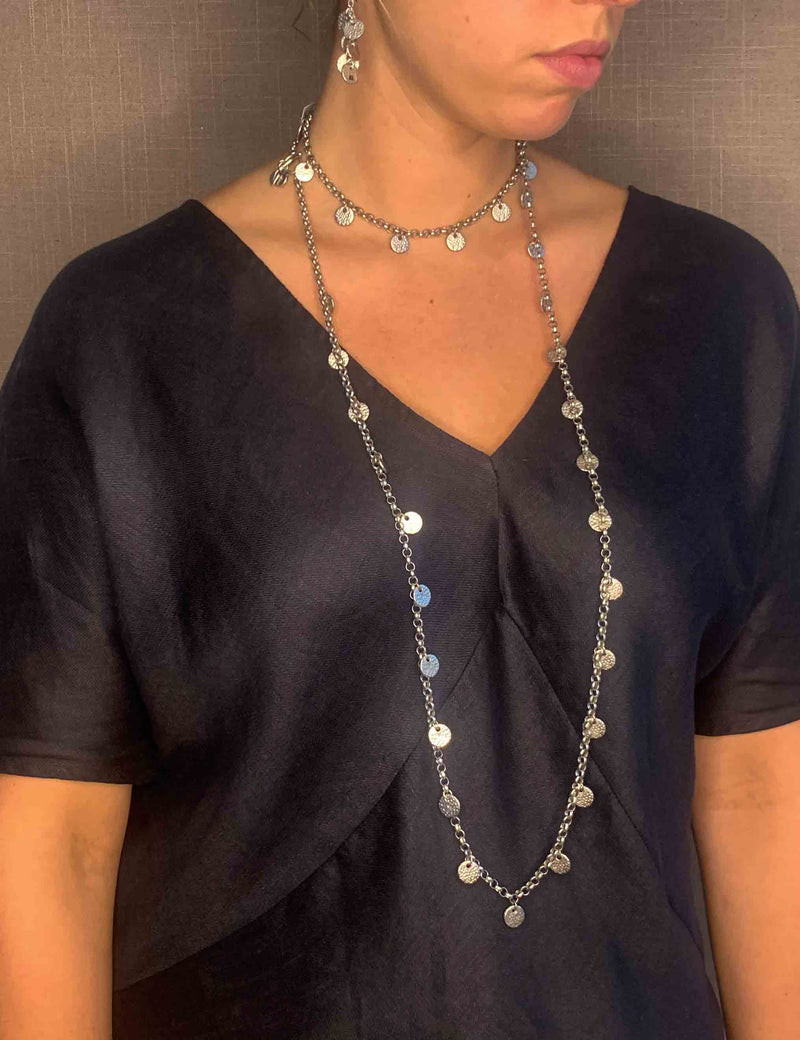 model wearing organic-shaped silver necklace