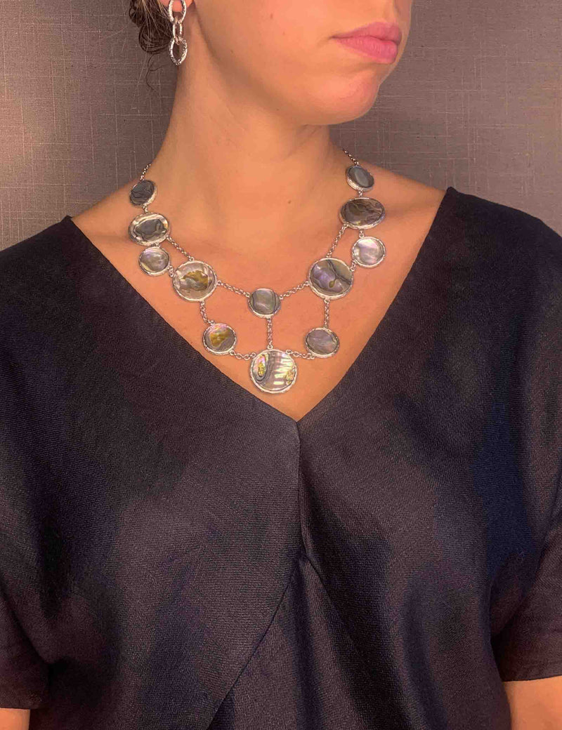 model wearing organic-shaped silver necklace