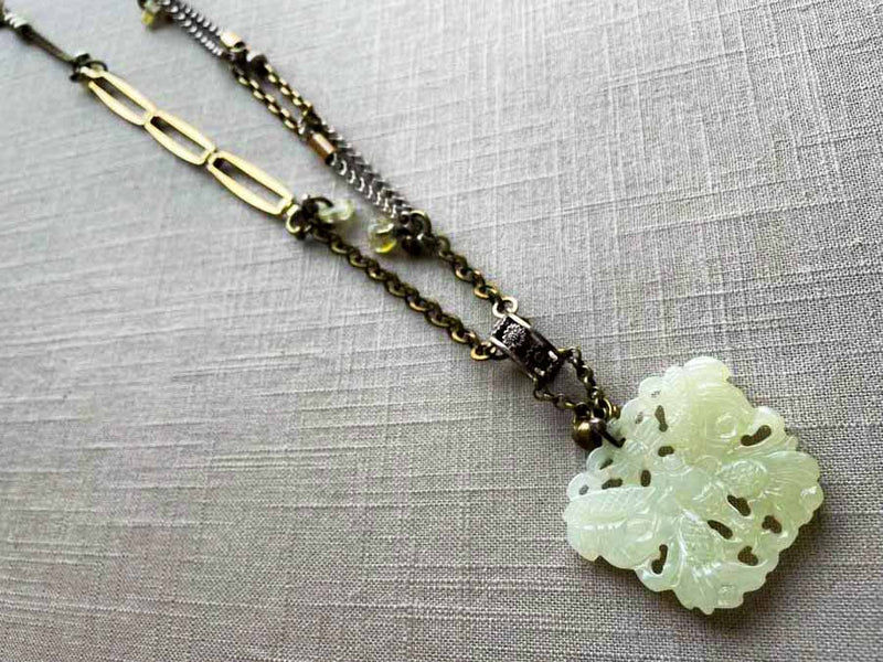 top view of antique jade butterfly pendant on chain mix