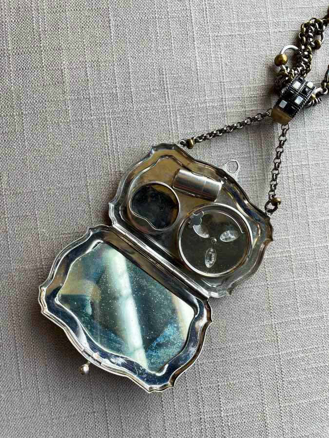 inside of antique sterling silver compact pendant on chain mix