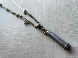 top view of antique sterling silver needle holder on chain mix