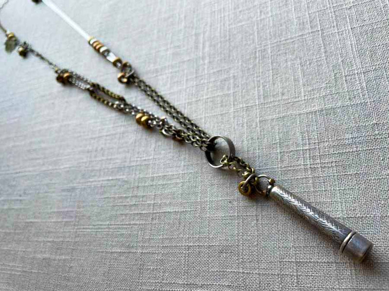 top view of antique sterling silver telescoping cigarette holder on chain mix