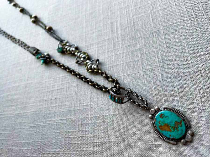 top view of modern sterling silver turquoise pendant on chain mix