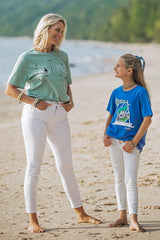 young girl wearing lake t-shirt with michigan mr. michi character