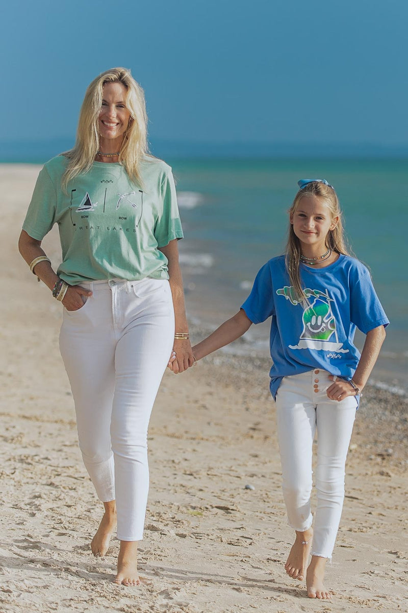 young girl wearing lake t-shirt with michigan mr. michi character